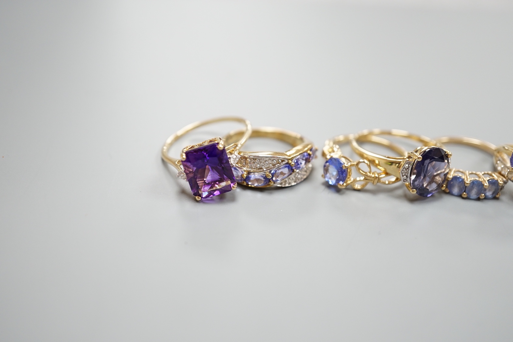 Six assorted modern 9ct gold gem set rings, including amethyst, gross 13.9 grams, a similar 14ct gold ring, gross 2.5 grams and a 925 ring.